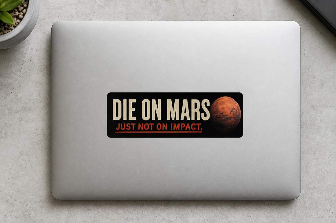 Overhead of Die on Mars bumper sticker on a closed laptop lid.